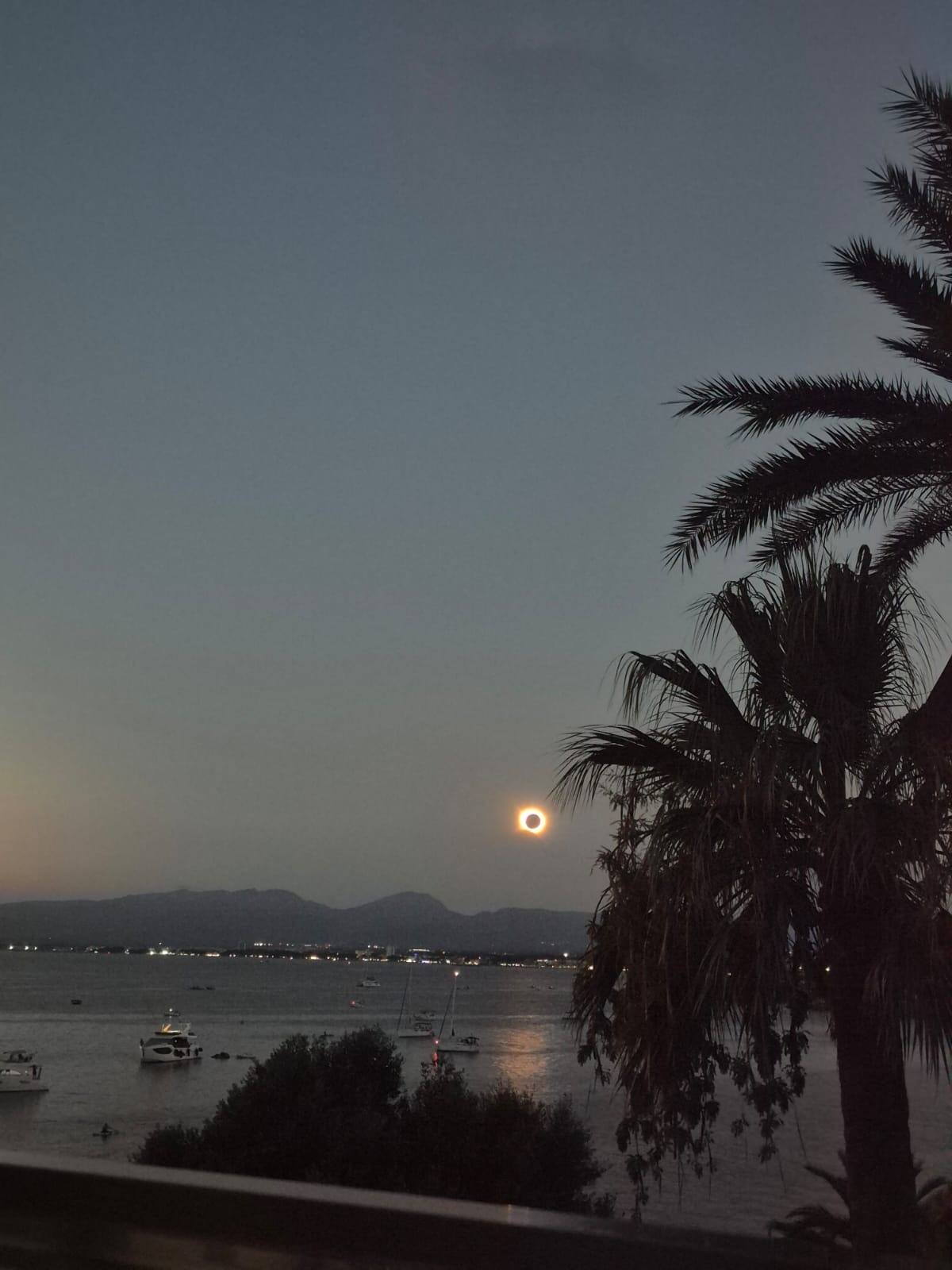 The eclipsed sun over the bay of Salou at dusk, photographed from the terrace of our Beach and Sunset View apartment